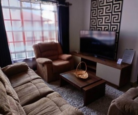 A 2 bedroom apartment that you can be free to be you. Located on the top floor therefore guaranteeing utmost privacy for the guests.Beautiful green environment,2 bedrooms ,2 bathrooms,wifi, Netflix and the most amazing hosts. You'll love it here.